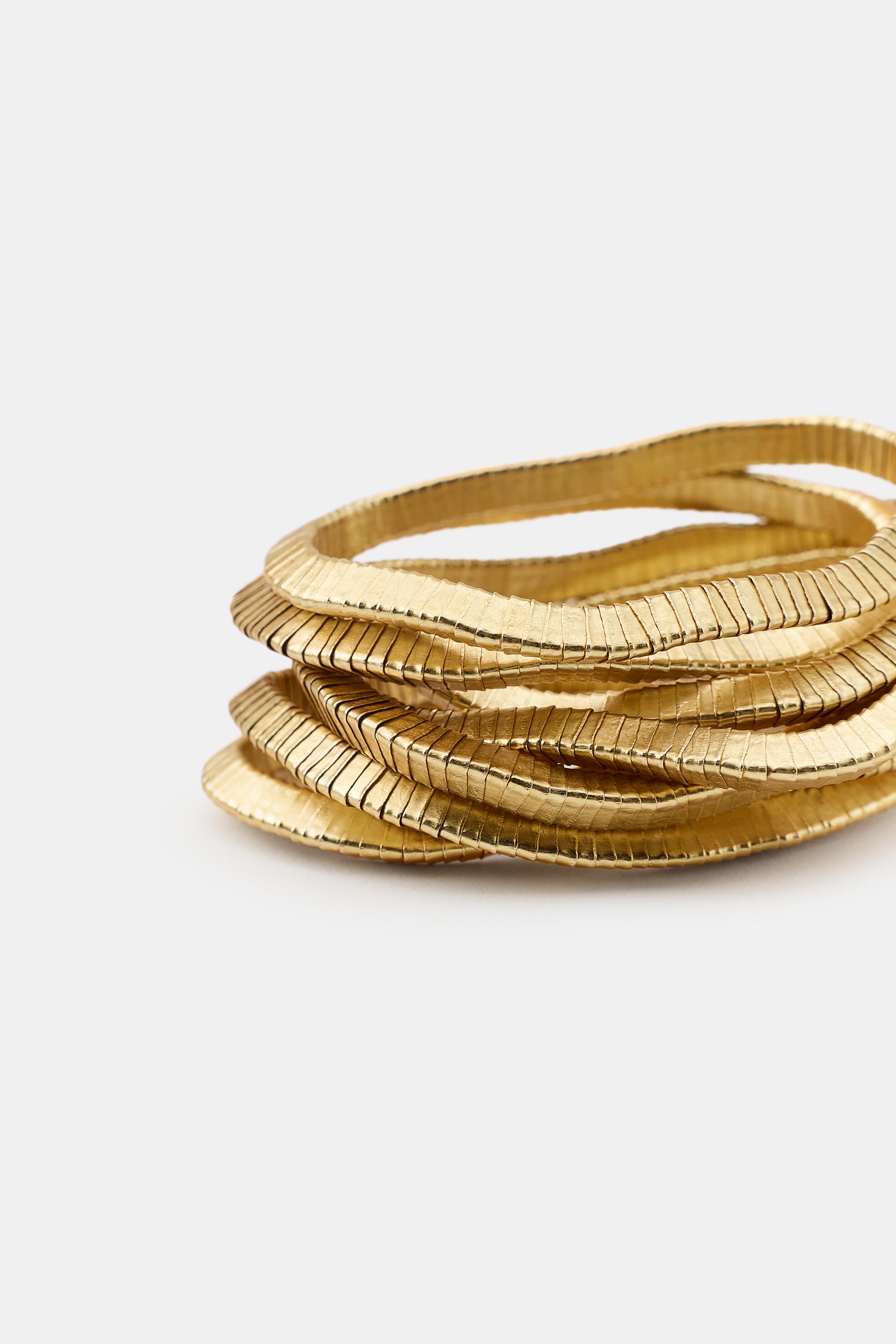 LOT DE BRACELETS ÉLASTIQUES À PIÈCES MÉTALLIQUES